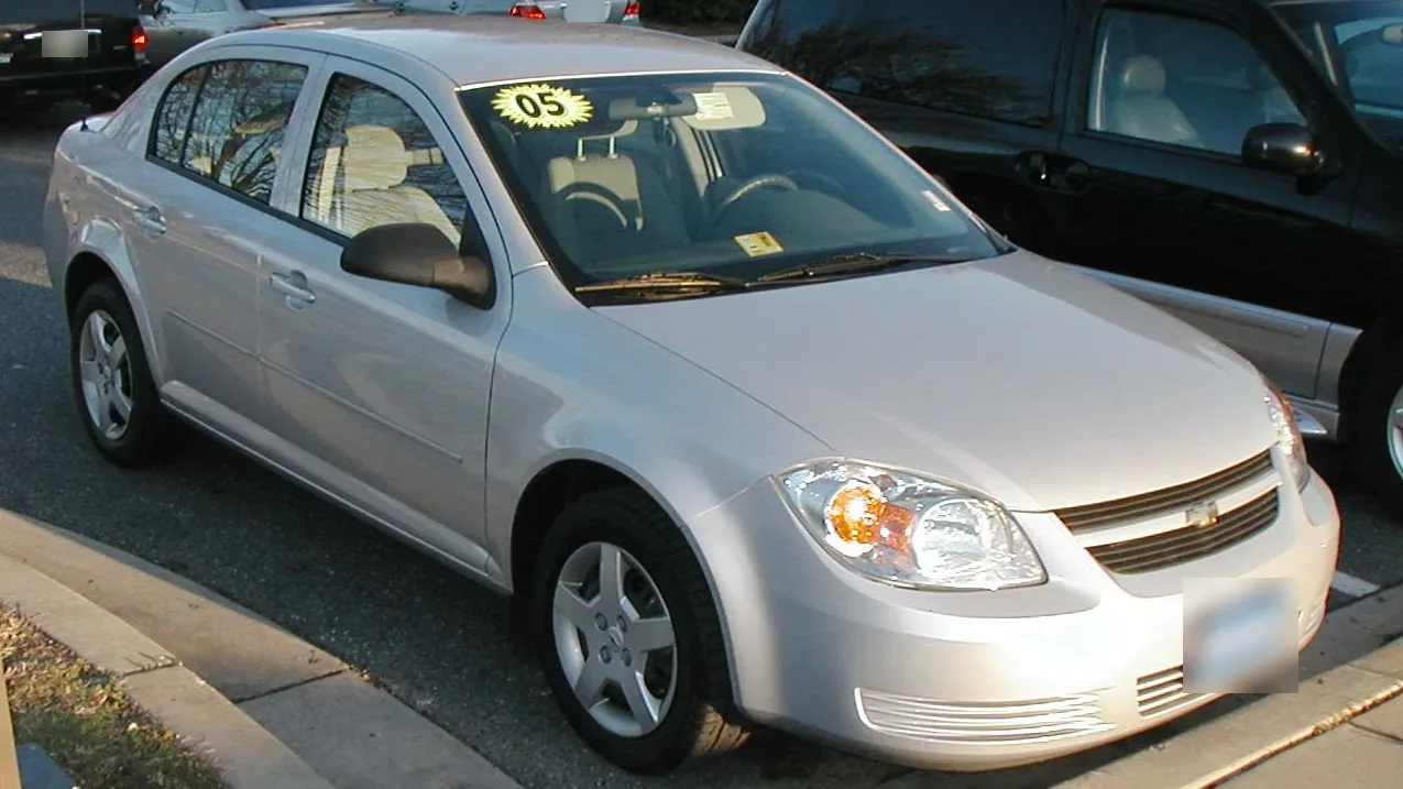 Silver 2005 Chevrolet Cobalt sedan parked at a dealership, seen from the front right